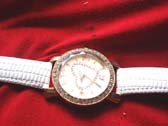 Fine heart image on clock face of stylish watch with white strap