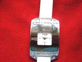 Solid silver framed watch with small cz stone on top and bottom and white strap