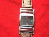 Premier day watch with brown imitation leather strap with buckle style attaching to squared clock face