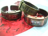 Tinted fashion colored bangle bracelet watch with G design on side and rectangular clock face
