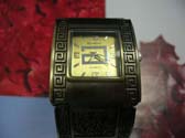 Copper bangle bracelet watch with squared spiral design