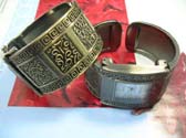 Copper bangle bracelet watch with squared spiral design