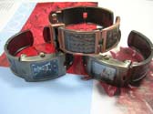 Antique style fashion watch with letter in clock face and stylish etchings on bangle bracelet