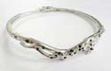 Fashion bangle in curvy pattern decor at center with multi mini clear and black cz synthetic stone embedded