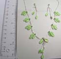 Fashion double chain green cat eye beaded earrings paired with silver green cat eye beaded necklace