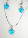 Fashion jewelry set, silver plated necklace holding a heart-shaped cz charm with spring ring clasp; same design fish hook earring