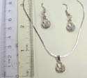 Fashion necklace and earring set, silver plated necklace holding cut-out purse pendant with a rounded clear cz inside, same design fish hook earring. Spring ring clasp