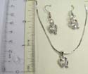 Fashion jewelry set, silver plated necklace holding a cut-out heart pendant with a clear cz on side paired with same design fish hook earring. Spring ring clasp