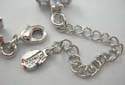 Fashion cz bracelet with assorted cz stone embedded in X and oval shapes, lobster claw clasp closure