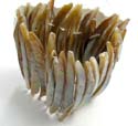 Fashion bracelet formed with long thin dyed seashell in brownish color