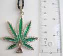 Fashion necklace with black twisted cord string holding green enamel coconut tree feature at center