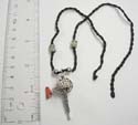 Fashion necklace with black twisted cord string holding a shaker feature pendant paired with an agate stone chip and 2 Celtic beads on sides. Adjustable for all sizes