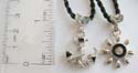 Friendship fashion necklace with black twisted cord string holding anchor / sun pendant
