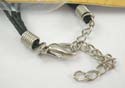 Fashion necklace with multi black thick cord strings holding a heart pendant in cut-out assorted pattern design with lobster claw clasp