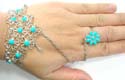 Fashion slave bracelet with imitation turquoise beads embedded in cut-out flower shape and silvery wrist-watch88er-drop pattern decor