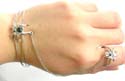 Fashion jewelry slave bangle bracelet-ring in carved-out double band design with black cz spider pattern decor at center 