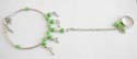 Fashion slave bangle-ring with rounded light green rhinestones embedded and multi silvery moon decor dangling 