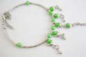 Fashion slave bangle-ring with rounded light green rhinestones embedded and multi silvery moon decor dangling 